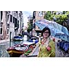 Beautiful tourist woman in Venice, exploring the old city