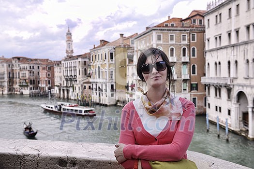 Beautiful tourist woman in Venice, exploring the old city Beautiful tourist woman in Venice, exploring the old city