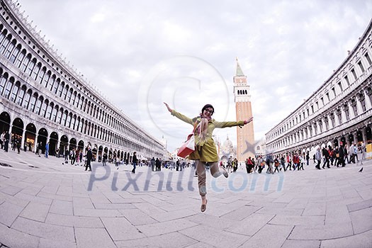 Beautiful tourist woman in Venice, exploring the old city Beautiful tourist woman in Venice, exploring the old city