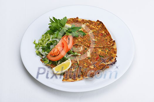 Homemade traditional Turkish meal pide stuffed with meat cheese,  and sauce isolated on white background