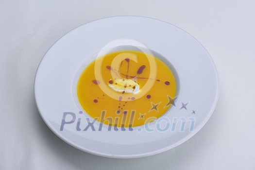 vegetable cream soup closeup isolated on white background vegetable cream soup closeup isolated on white background