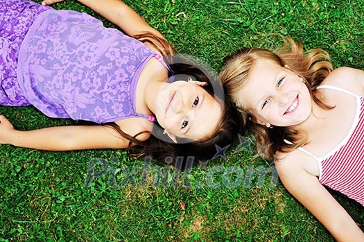 two happy young girls children  have fun outdoor in nature