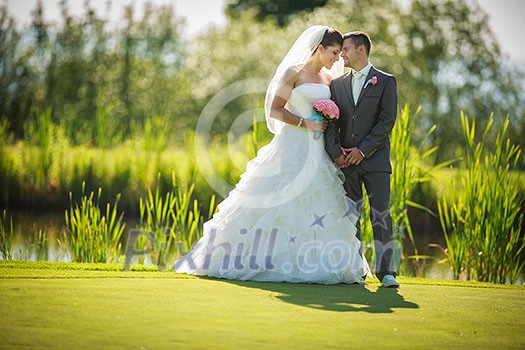 Portrait of a young wedding couple on their wedding day Portrait of a young wedding couple on their wedding day