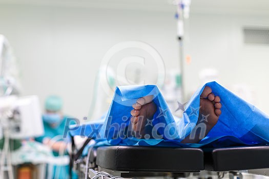 Feet of a patient ready for a surgery in a surgery room (color toned image; shallow DOF) Feet of a patient ready for a surgery in a surgery room (color toned image; shallow DOF)