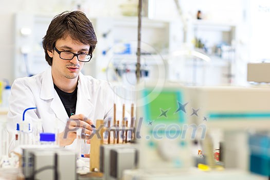 Male researcher carrying out scientific research in a lab (shallow DOF; color toned image) Male researcher carrying out scientific research in a lab (shallow DOF; color toned image)