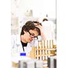 Male researcher carrying out scientific research in a lab (shallow DOF; color toned image)