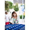 Beautiful young woman going shopping for groceries (color toned image)