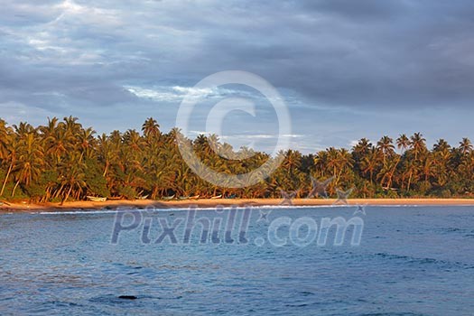 Fishing boats on beach on sunset. Mirissa, Sri Lanka Fishing boats on beach on sunset. Mirissa, Sri Lanka