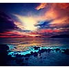 Vintage retro hipster style travel image of ocean sunset with great cloudscape