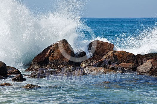 Waves breaking against the rocks