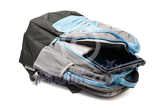 Backpack with a laptop inside isolated on white background Backpack with a laptop inside isolated on white background