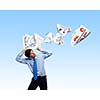 Young businessman holding frame above head with papers flying out