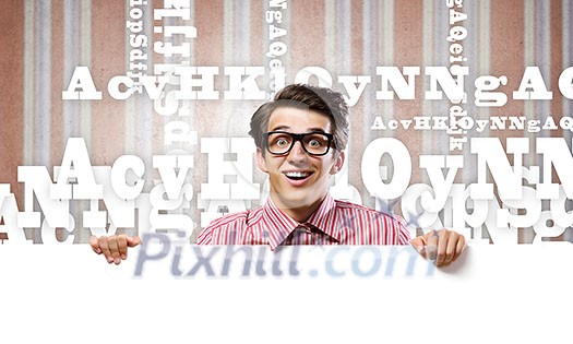 Young man in casual holding white blank banner Young man in casual holding white blank banner