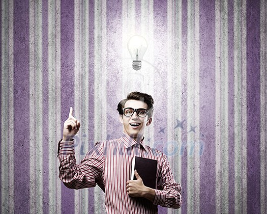 Young man in casual with book in hands Young man in casual with book in hands