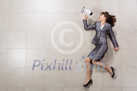 Funny image of businesswoman running with megaphone in hands Funny image of businesswoman running with megaphone in hands