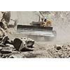 Bulldozer cleaning landslide from road in Himalayas. Himachal Pradesh, India