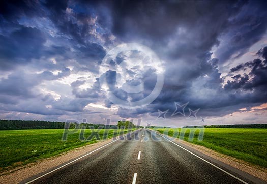 Travel concept background - road and stormy dramatic sky Travel concept background - road and stormy dramatic sky