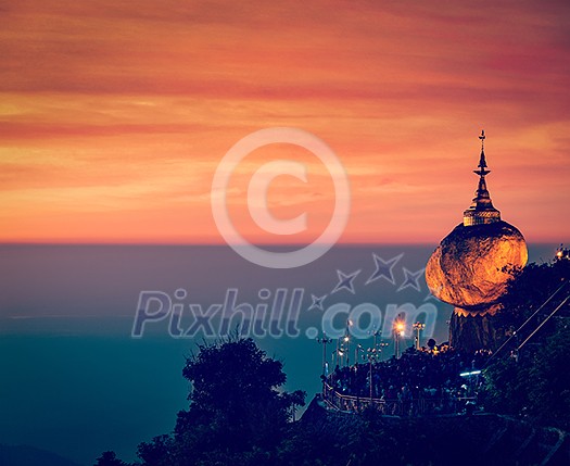 Vintage retro effect filtered hipster style image of Golden Rock - Kyaiktiyo Pagoda - famous Myanmar landmark, Buddhist pilgrimage site and tourist attraction, Myanmar Vintage retro effect filtered hipster style image of Golden Rock - Kyaiktiyo Pagoda - famous Myanmar landmark, Buddhist pilgrimage site and tourist attraction, Myanmar