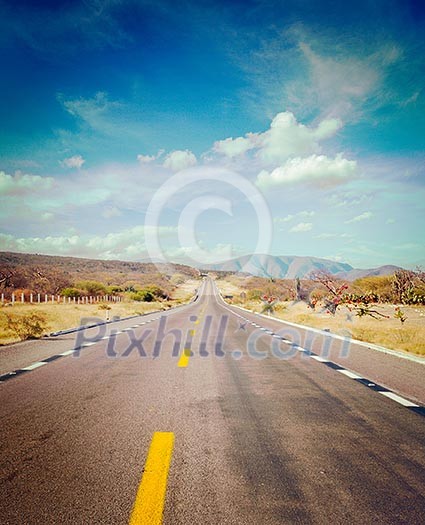 Vintage retro effect filtered hipster style image of travel forward concept background - road in desert Vintage retro effect filtered hipster style image of travel forward concept background - road in desert