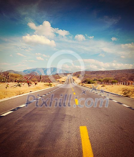 Vintage retro effect filtered hipster style image of travel forward concept background - road in desert Vintage retro effect filtered hipster style image of travel forward concept background - road in desert