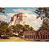 Vintage retro effect filtered hipster style image of anicent mayan pyramid Pyramid of the Magician, Adivino in Uxmal, Merida, Yucatan, Mexico