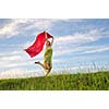 beautiful young and healthy woman run and jump on meadow at sunny day with red scarf