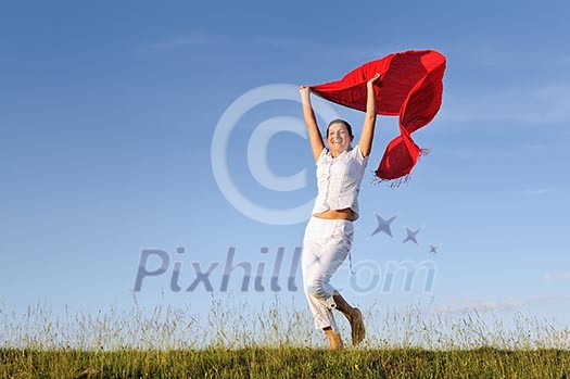 beautiful young and healthy woman run and jump on meadow at sunny day with red scarf beautiful young and healthy woman run and jump on meadow at sunny day with red scarf
