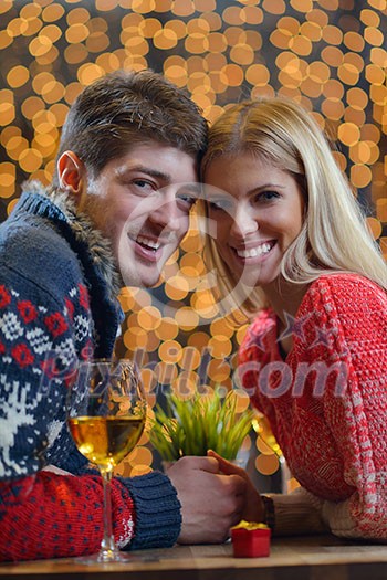 romantic evening date in restaurant  happy young couple with wine glass tea and cake