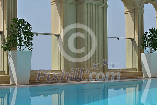 roof swimming pool at top of the hotel with blue sky in background