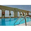 roof swimming pool at top of the hotel with blue sky in background