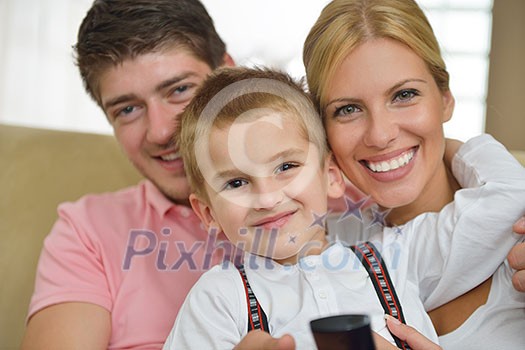 happy young family with kids in bright modern living room have fun and looking big flat lcd tv happy young family with kids in bright modern living room have fun and looking big flat lcd tv