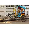 Empty bicycle rickshaw in street. Pondicherry, South India