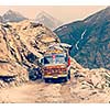 Vintage retro effect filtered hipster style travel image of Manali-Leh road in Indian Himalayas with lorry. Himachal Pradesh, India