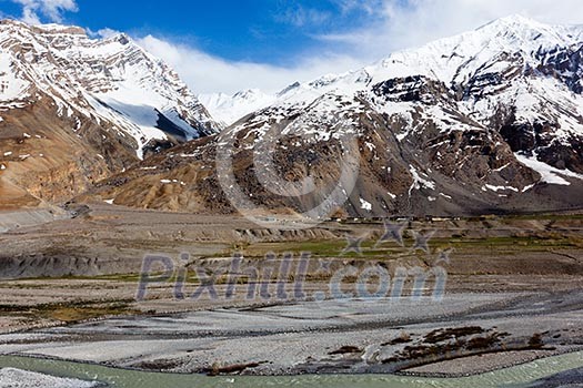 Spiti Valley - village and snowcapped Himalayan Mountains. Himachal Pradesh, India