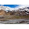 Spiti Valley - village and snowcapped Himalayan Mountains. Himachal Pradesh, India