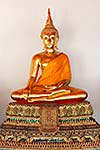 Sitting Buddha Gold Statue close up in Buddhist Temple. Wat Pho, Bangkok, Thailand