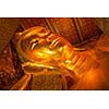 Reclining Buddha gold statue face. Wat Pho, Bangkok, Thailand