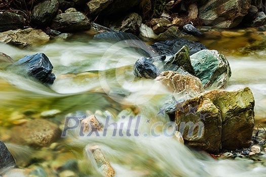 Mountain stream and rocks. Long exposure