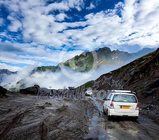 Vehicles on bad road in Himalayas. Near Rohtang La pass, Himachal Pradesh, India