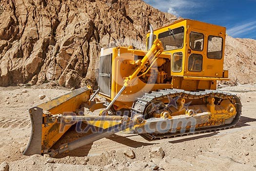 Bulldozer doing road construction in Himalayas. Ladakh, Jammu and Kashmir, India