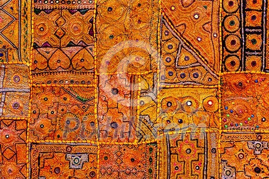 Colorful indian fabric textile texture background patchwork carpet quilt. India Colorful indian fabric textile texture background patchwork carpet quilt. India