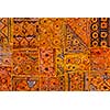 Colorful indian fabric textile texture background patchwork carpet quilt. India