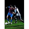competition Action run and jump Duel of football players at soccer ball stadium at night