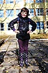 one young  happy school girl posing outdoor in park