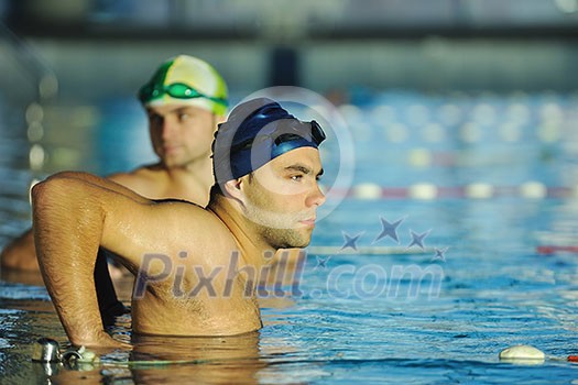 win competiotion and swimming race concept with two freiend who handshaking in pool win competiotion and swimming race concept with two freiend who handshaking in pool