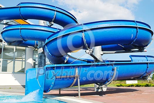 happy child have fun on water slike on outdoor swimming pool happy child have fun on water slike on outdoor swimming pool