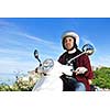 young man ride white  retro vintage motorbike scooter