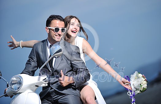 wedding sce of bride and groom just married couple on the beach ride white scooter and have fun wedding sce of bride and groom just married couple on the beach ride white scooter and have fun