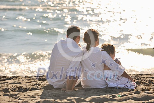 happy young family in white clothing have fun at vacations on beautiful beach happy young family in white clothing have fun at vacations on beautiful beach