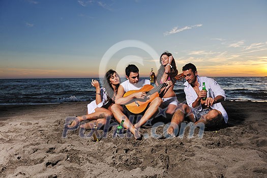 happy young friends group have fun and celebrate while jumping and running on the beach at the sunset happy young friends group have fun and celebrate while jumping and running on the beach at the sunset